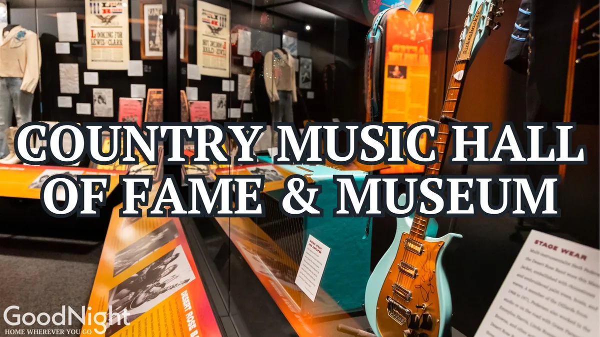 This image showcases the interior of the Country Music Hall of Fame and Museum, featuring guitars, stage wear, and historical posters on display. The artifacts evoke a sense of music history and cultural significance, inviting families to learn and engage together.