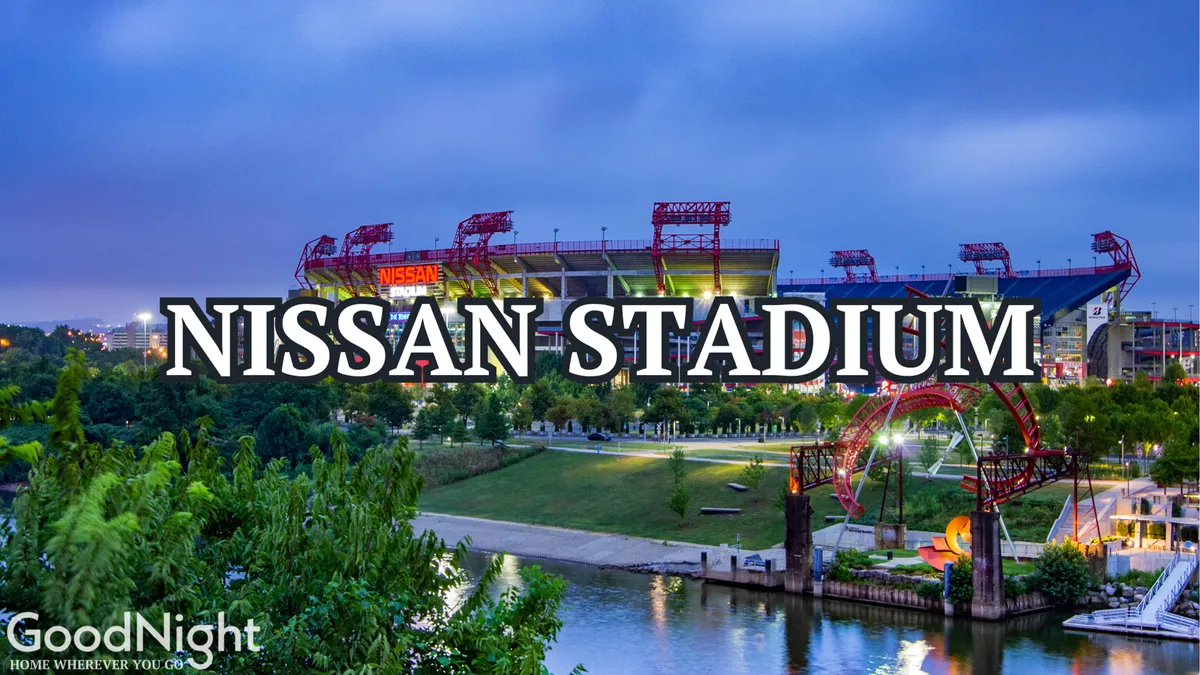 This exterior image features Nissan Stadium alongside a vibrant park area, the river, and a bridge, capturing an energetic urban environment where major sporting and music events take place. The stadium is a prominent landmark, surrounded by green space and the city skyline.